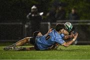 31 March 2023; James Tarrant of UCD in action against Colm Hogan of DUFC during the annual rugby colours match between University College Dublin and Dublin University at the UCD Bowl in Belfield, Dublin. Photo by Sam Barnes/Sportsfile