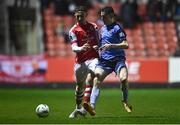 31 March 2023; Sam Curtis of St Patrick's Athletic in action against Jake Doyle of UCD during the SSE Airtricity Men's Premier Division match between St Patrick's Athletic and UCD at Richmond Park in Dublin. Photo by Ben McShane/Sportsfile