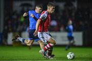 31 March 2023; Thomas Lonergan of St Patrick's Athletic in action against Michael Gallagher of UCD during the SSE Airtricity Men's Premier Division match between St Patrick's Athletic and UCD at Richmond Park in Dublin. Photo by Ben McShane/Sportsfile