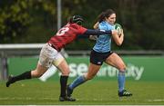 31 March 2023; Cliodhna O'Sullivan of UCD evades the tackle of Katie Jane Wickham of DUFC during the Annual Women's Rugby Colours match between University College Dublin and University College Dublin at UCD Bowl in Belfield, Dublin. Photo by Harry Murphy/Sportsfile