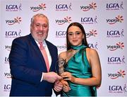 31 March 2023; Amy Dunleavy of University of Galway receives her Yoplait Rising Stars award from Ladies HEC chairperson Daniel Caldwell at the 2022 Yoplait HEC All Stars evening, at the Dublin Bonnington Hotel in Dublin. Photo by Piaras Ó Mídheach/Sportsfile