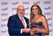 31 March 2023; Ciara Mulligan of DKIT receives her Yoplait Rising Stars award from Ladies HEC chairperson Daniel Caldwell at the 2022 Yoplait HEC All Stars evening, at the Dublin Bonnington Hotel in Dublin. Photo by Piaras Ó Mídheach/Sportsfile