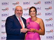 31 March 2023; Eimile Loughran of Ulster University receives her Yoplait Rising Stars award from Ladies HEC chairperson Daniel Caldwell at the 2022 Yoplait HEC All Stars evening, at the Dublin Bonnington Hotel in Dublin. Photo by Piaras Ó Mídheach/Sportsfile