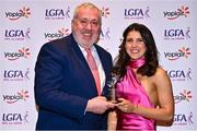 31 March 2023; Kaioni Tuipolotu of University of Limerick receives her Yoplait Rising Stars award from Ladies HEC chairperson Daniel Caldwell at the 2022 Yoplait HEC All Stars evening, at the Dublin Bonnington Hotel in Dublin. Photo by Piaras Ó Mídheach/Sportsfile