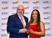 31 March 2023; Claire Dunne of DCU Dóchas Éireann receives her Yoplait All-Stars award from Ladies HEC chairperson Daniel Caldwell at the 2022 Yoplait HEC All Stars evening, at the Dublin Bonnington Hotel in Dublin. Photo by Piaras Ó Mídheach/Sportsfile