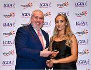 31 March 2023; Ciara Needham of University of Limerick receives her Yoplait All-Stars award from Ladies HEC chairperson Daniel Caldwell at the 2022 Yoplait HEC All Stars evening, at the Dublin Bonnington Hotel in Dublin. Photo by Piaras Ó Mídheach/Sportsfile