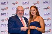 31 March 2023; Kate Kenny of DCU Dóchas Éireann receives her Yoplait All-Stars award from Ladies HEC chairperson Daniel Caldwell at the 2022 Yoplait HEC All Stars evening, at the Dublin Bonnington Hotel in Dublin. Photo by Piaras Ó Mídheach/Sportsfile