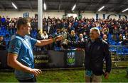 31 March 2023; UCD captain Bobby Sheehan is presented with the cup by UCD Rugby President Brian Gilsenan after his side's victory in the annual rugby colours match between University College Dublin and Dublin University at the UCD Bowl in Belfield, Dublin. Photo by Sam Barnes/Sportsfile