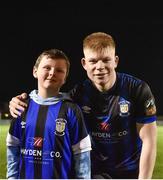 31 March 2023; Aaron Connolly of Athlone Town with Conor McLaughlin, age 8, of Belmont, Offaly, after the SSE Airtricity Men's First Division match between Athlone Town and Galway United at Athlone Town Stadium in Westmeath. Photo by Stephen Marken/Sportsfile