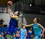 1 April 2023; Amy Dooley of The Address UCC Glanmire scores a basket despite the attention of Rachel Huijsdens of DCU Mercy during the MissQuote.ie Champions Trophy Final match between The Address UCC Glanmire, Cork and DCU Mercy, Dublin at National Basketball Arena in Tallaght, Dublin. Photo by Ben McShane/Sportsfile