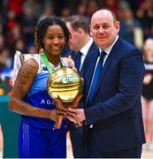1 April 2023; Brittany Byrd of The Address UCC Glanmire is presented the MVP award by Basketball Ireland president PJ Reidy after the MissQuote.ie Champions Trophy Final match between The Address UCC Glanmire, Cork and DCU Mercy, Dublin at National Basketball Arena in Tallaght, Dublin. Photo by Ben McShane/Sportsfile
