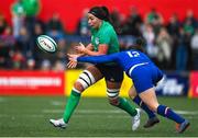 1 April 2023; Nichola Fryday of Ireland gets a pass away despite the tackle of Gabrielle Vernier of France during the TikTok Women's Six Nations Rugby Championship match between Ireland and France at Musgrave Park in Cork. Photo by Brendan Moran/Sportsfile