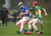 1 April 2023; Diarmaid Carney of Cavan in action against Aaron McLaughlin, centre, and Paul Lenehan of Leitrim during the Allianz Hurling League Division 3B Final match between Cavan and Leitrim at GAA National Games Development Centre in Sport Ireland Campus in Dublin. Photo by David Fitzgerald/Sportsfile