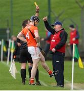 1 April 2023; Roscommon manager Seamus Qualter is shown a yellow card by referee James Connors during the Allianz Hurling League Division 3A Final match between Roscommon and Armagh at Páirc Tailteann in Navan, Meath. Photo by Michael P Ryan/Sportsfile