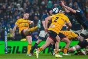 1 April 2023; John Cooney of Ulster has a kick blocked by Ryan Baird of Leinster during the Heineken Champions Cup Round of 16 match between Leinster and Ulster at Aviva Stadium in Dublin. Photo by Ramsey Cardy/Sportsfile