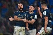 1 April 2023; Jamison Gibson-Park, left, celebrates with teammates Hugo Keenan, centre, and Ross Byrne after scoring his side's second try during the Heineken Champions Cup Round of 16 match between Leinster and Ulster at Aviva Stadium in Dublin. Photo by Ramsey Cardy/Sportsfile
