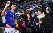1 April 2023; Tiarnan Madden of Cavan takes a selfie with supporters after his side's victory in the Allianz Football League Division 3 Final match between Cavan and Fermanagh at Croke Park in Dublin. Photo by Piaras Ó Mídheach/Sportsfile
