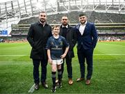 1 April 2023; Match day mascot Bobby Fox with Leinster players, from left, Rónan Kelleher, Charlie Ngatai and Vakhtang Abdaladze at the Heineken Champions Cup Round of 16 match between Leinster and Ulster at Aviva Stadium in Dublin. Photo by Harry Murphy/Sportsfile