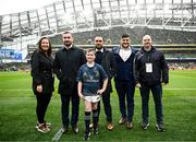 1 April 2023; Match day mascot Bobby Fox and family with Leinster players, from left, Rónan Kelleher, Charlie Ngatai and Vakhtang Abdaladze at the Heineken Champions Cup Round of 16 match between Leinster and Ulster at Aviva Stadium in Dublin. Photo by Harry Murphy/Sportsfile