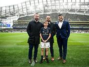 1 April 2023; Match day mascot Leo Geraghty with Leinster players, from left, Rónan Kelleher, Charlie Ngatai and Vakhtang Abdaladze at the Heineken Champions Cup Round of 16 match between Leinster and Ulster at Aviva Stadium in Dublin. Photo by Harry Murphy/Sportsfile