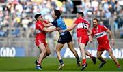 2 April 2023; Michael Fitzsimons of Dublin in action against Ben McCarron, left, and Niall Loughlin of Derry during the Allianz Football League Division 2 Final match between Dublin and Derry at Croke Park in Dublin. Photo by Sam Barnes/Sportsfile