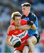 2 April 2023; Brendan Rogers of Derry is tackled by Lee Gannon of Dublin during the Allianz Football League Division 2 Final match between Dublin and Derry at Croke Park in Dublin. Photo by Ramsey Cardy/Sportsfile