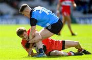 2 April 2023; Brendan Rogers of Derry is tackled by Lee Gannon of Dublin during the Allianz Football League Division 2 Final match between Dublin and Derry at Croke Park in Dublin. Photo by Ramsey Cardy/Sportsfile