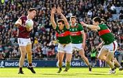 2 April 2023; Seán Kelly of Galway scores a point under pressure from Sam Callinan, left, and Conor Loftus of Mayo during the Allianz Football League Division 1 Final match between Galway and Mayo at Croke Park in Dublin. Photo by Ramsey Cardy/Sportsfile