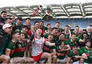2 April 2023; Mayo players, including goalkeeper Colm Reape, centre, celebrate with the cup after their side's victory in the Allianz Football League Division 1 Final match between Galway and Mayo at Croke Park in Dublin. Photo by Sam Barnes/Sportsfile