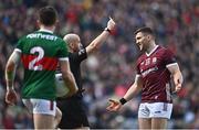 2 April 2023; Damien Comer of Galway is shown a yellow card by  Referee Brendan Cawley during the Allianz Football League Division 1 Final match between Galway and Mayo at Croke Park in Dublin. Photo by Sam Barnes/Sportsfile