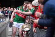 2 April 2023; Paddy Durcan of Mayo poses with a supporter for a selfie with the cup after his side's victory in the Allianz Football League Division 1 Final match between Galway and Mayo at Croke Park in Dublin. Photo by Sam Barnes/Sportsfile