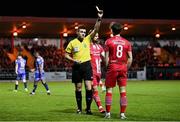 1 April 2023; Referee Rob Hennessy shows a yellow card to Niall Morahan of Sligo Rovers during the SSE Airtricity Men's Premier Division match between Sligo Rovers and Bohemians at The Showgrounds in Sligo. Photo by Seb Daly/Sportsfile