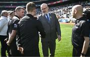 2 April 2023; Uachtarán Chumann Lúthchleas Gael Larry McCarthy greets the referee team before the Allianz Football League Division 2 Final match between Dublin and Derry at Croke Park in Dublin. Photo by Ramsey Cardy/Sportsfile