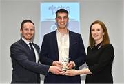 3 April 2023; 2023 2023 Electric Ireland GAA Higher Education Rising Stars Hurler of the Year Mikey Kiely of UL and Abbeyside, Waterford, centre, receives his footballer of the year award from Chair of the GAA Higher Education Committee Michael Hyland and Electric Ireland Group Sponsorship Manager Sarah Sharkey during the 2023 Electric Ireland GAA HEC Rising Star Awards at the Castletroy Park Hotel in Limerick. Photo by Sam Barnes/Sportsfile