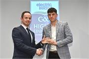 3 April 2023; Eoin Lawless of University of Galway and Athenry, Galway, right, receives his 2023 Electric Ireland GAA Higher Education Rising Stars Hurling Team of the Year Award from Chair of the GAA Higher Education Committee Michael Hyland during the 2023 Electric Ireland GAA HEC Rising Star Awards at the Castletroy Park Hotel in Limerick. Photo by Sam Barnes/Sportsfile