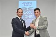 3 April 2023; Mark Cronin of UCC and Nemo Rangers, Cork, right, receives his 2023 Electric Ireland GAA Higher Education Rising Stars Football Team of the Year Award from Chair of the GAA Higher Education Committee Michael Hyland during the 2023 Electric Ireland GAA HEC Rising Star Awards at the Castletroy Park Hotel in Limerick. Photo by Sam Barnes/Sportsfile