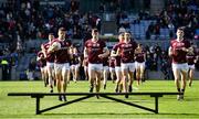 2 April 2023; Galway players, including from left, Seán Kelly, Matthew Tierney, Ian Burke and Owen Gallagher, make their way on to the pitch for a team photograph before the Allianz Football League Division 1 Final match between Galway and Mayo at Croke Park in Dublin. Photo by Sam Barnes/Sportsfile