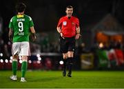 31 March 2023; Referee Rob Harvey with Ruairi Keating of Cork City during the SSE Airtricity Men's Premier Division match between Cork City and Drogheda United at Turner's Cross in Cork. Photo by Eóin Noonan/Sportsfile