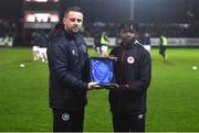 31 March 2023; St Patrick's Athletic academy manager Ger O'Brien presents the U14 Player of the Month award to Sammy Ogungbe at half-time of the SSE Airtricity Men's Premier Division match between St Patrick's Athletic and UCD at Richmond Park in Dublin. Photo by Ben McShane/Sportsfile