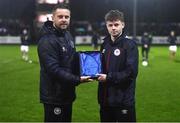 31 March 2023; St Patrick's Athletic academy manager Ger O'Brien presents the U15 Player of the Month award to Billy Canny at half-time of the SSE Airtricity Men's Premier Division match between St Patrick's Athletic and UCD at Richmond Park in Dublin. Photo by Ben McShane/Sportsfile