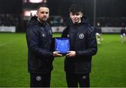 31 March 2023; St Patrick's Athletic academy manager Ger O'Brien presents the U19 Player of the Month award to Rhys Bartley at half-time of the SSE Airtricity Men's Premier Division match between St Patrick's Athletic and UCD at Richmond Park in Dublin. Photo by Ben McShane/Sportsfile