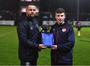 31 March 2023; St Patrick's Athletic academy manager Ger O'Brien presents the U17 Men's Player of the Month award to Matthew O'Hara at half-time of the SSE Airtricity Men's Premier Division match between St Patrick's Athletic and UCD at Richmond Park in Dublin. Photo by Ben McShane/Sportsfile