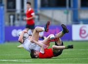 5 April 2023; Jonathon Groenwald of Midlands is tackled by Iaasc Soden of North East during the Shane Horgan Round Five match between Midlands and North East at Energia Park in Dublin. Photo by Tyler Miller/Sportsfile