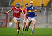 5 April 2023; James Morris of Tipperary in action against Colin Walsh of Cork during the oneills.com Munster GAA Hurling U20 Championship Round 3 match between Cork and Tipperary at Páirc Uí Chaoimh in Cork. Photo by Eóin Noonan/Sportsfile