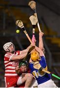 5 April 2023; Sean Kenneally of Tipperary scores his side's first goal despite the efforts of Cork goalkeeper Brion Saunderson during the oneills.com Munster GAA Hurling U20 Championship Round 3 match between Cork and Tipperary at Páirc Uí Chaoimh in Cork. Photo by Stephen Marken/Sportsfile