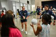 6 April 2023; Monica McGuirk, left, and Emma Troy of Meath with fourth grade students during a Ladies Football coaching clinic at the Casis Elementary School during the 2023 TG4 LGFA All-Star Tour to Austin in Texas, USA. Photo by Brendan Moran/Sportsfile