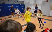 6 April 2023; Danielle Caldwell, left, and Sinéad Cafferky of Mayo with third grade students during a Ladies Football coaching clinic at the Casis Elementary School during the 2023 TG4 LGFA All-Star Tour to Austin in Texas, USA. Photo by Brendan Moran/Sportsfile