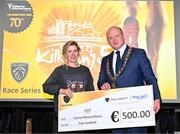 6 April 2023; Ide Nic Dhomhnaill of West Limerick AC, who won the women's event, receives her prize for setting a course record from Mayor of Kilkenny, Cllr David Fitzgerald, after the Peugeot Race Series - Streets of Kilkenny 2023 in Kilkenny. Photo by Sam Barnes/Sportsfile