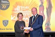 6 April 2023; Ide Nic Dhomhnaill of West Limerick AC, who won the women's event, receives her prize from Mayor of Kilkenny, Cllr David Fitzgerald, after the Peugeot Race Series - Streets of Kilkenny 2023 in Kilkenny. Photo by Sam Barnes/Sportsfile