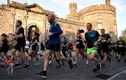 6 April 2023; Runners pass Kilkenny Castle at the start of the Peugeot Race Series - Streets of Kilkenny 2023 in Kilkenny. Photo by Sam Barnes/Sportsfile